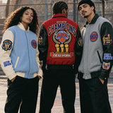 New York Knicks 2026 Champions Wool & Leather Varsity Jackets in Nova Blue, Red and Gray, worn on a New York basketball court